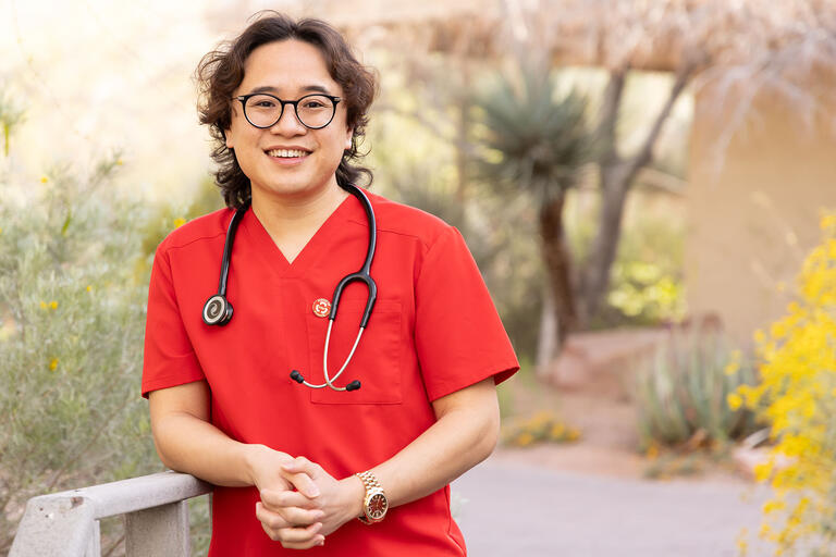 man in red nursing scrubs